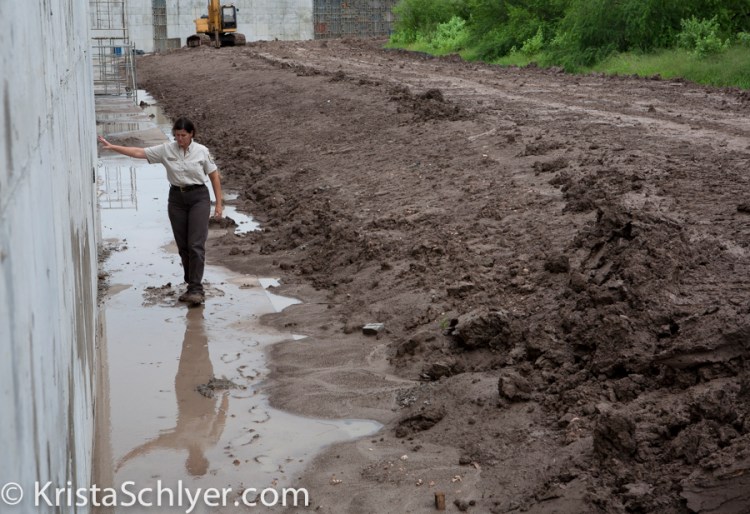 89. Wildlife refuge staff Nancy Brown at a wall construction site.